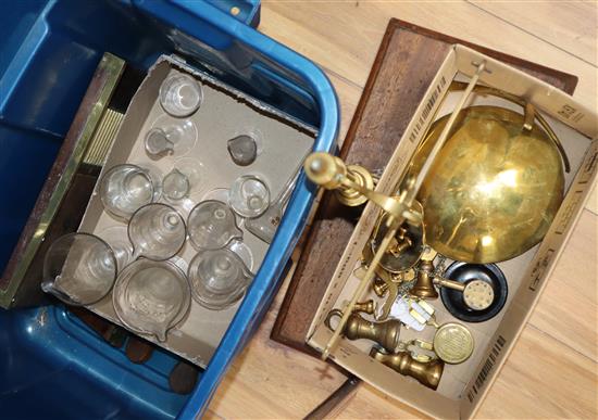 A group of pill making machines, brass balance scales and chemists measures